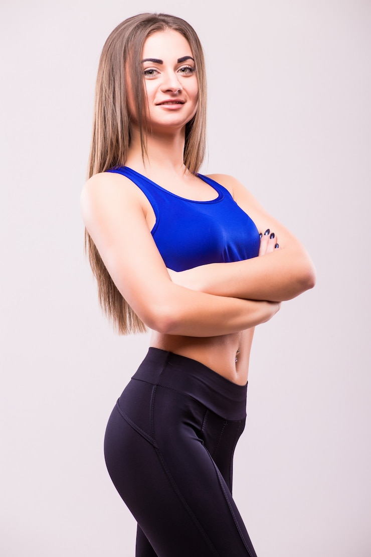 Free Photo posing fitness sexy woman isolated on white background