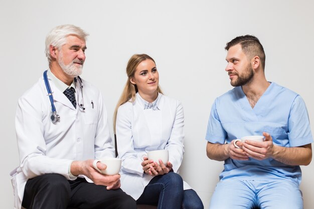 position smiling stethoscope male mixed looking