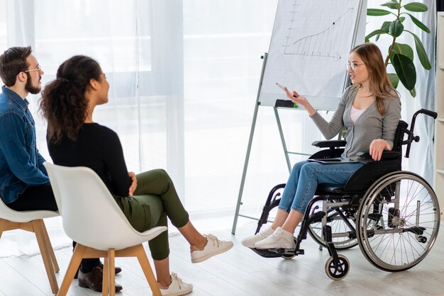 Positive adult man and women discussing a project