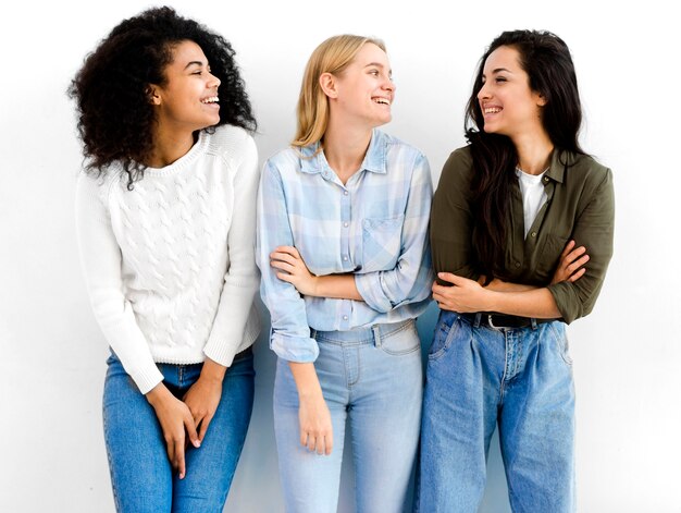 Positive adult women posing together