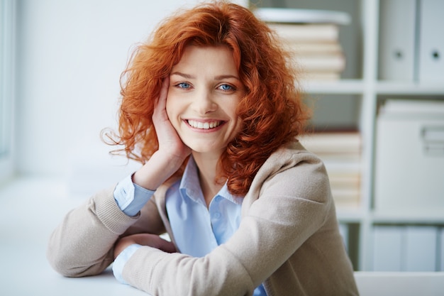 Free photo positive entrepreneur sitting