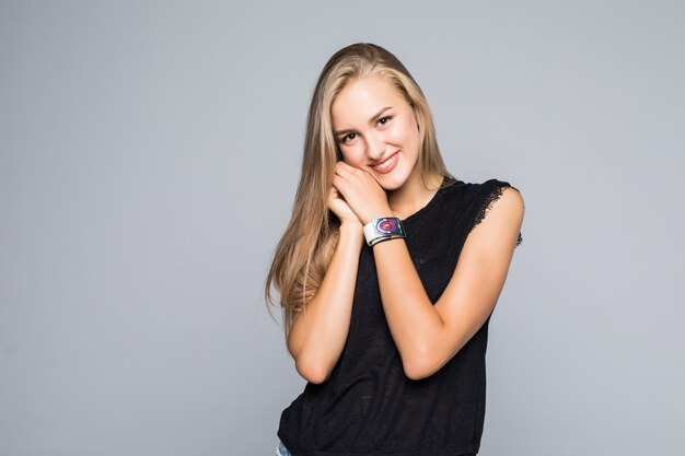 Positive human emotions. Headshot of happy emotional teenage girl having fun isolated on gray background