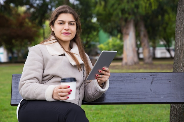 Free photo positive latin student enjoying coffee break