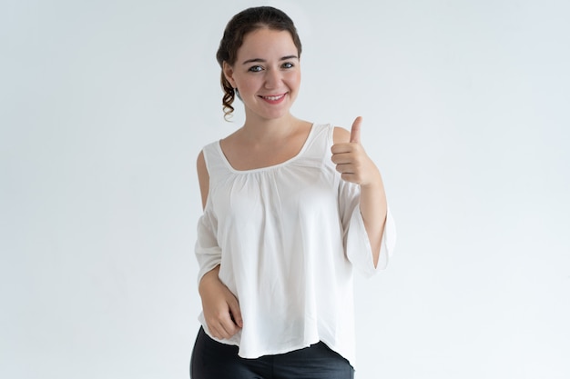 Positive lovely woman showing thumb up