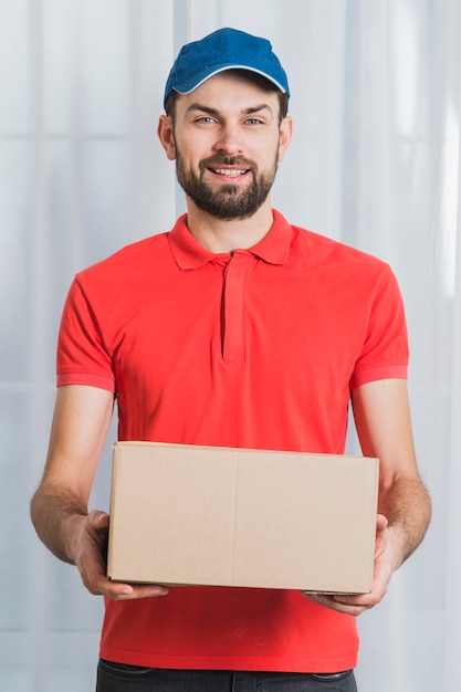 Positive man delivering parcel