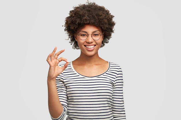 Positive mixed race female model has Afro hairstyle