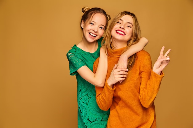 Positive models posing with their dresses