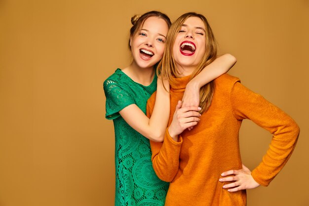 Positive models posing with their dresses