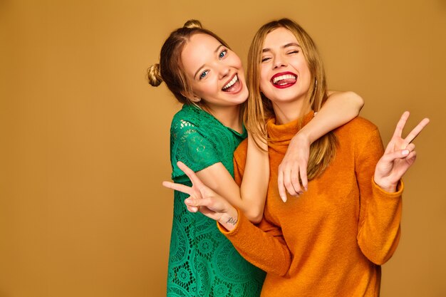 Positive models posing with their dresses