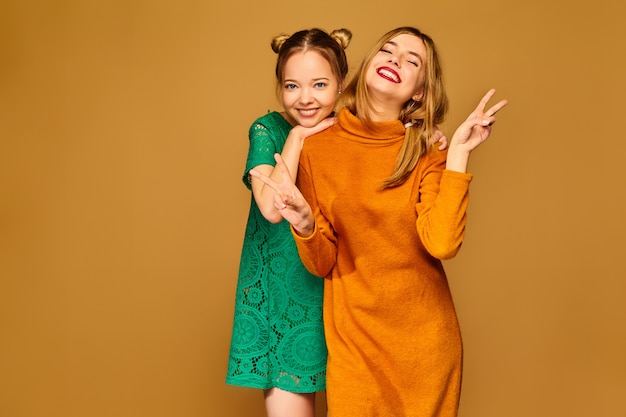 Positive models posing with their dresses