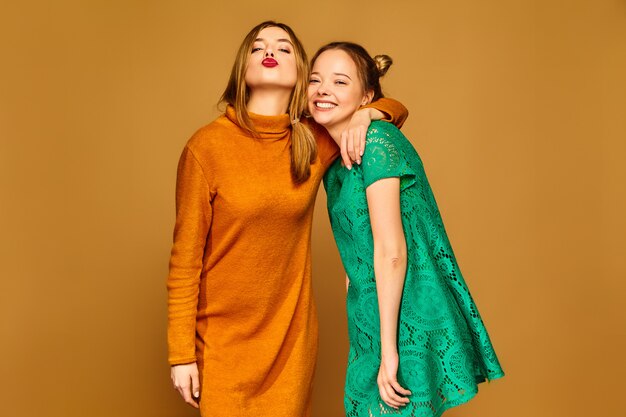 Positive models posing with their dresses