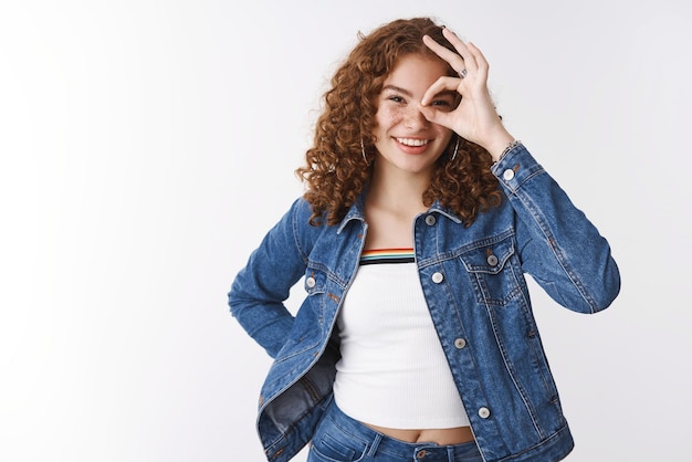 Positive  redhead girl showing ok gesture