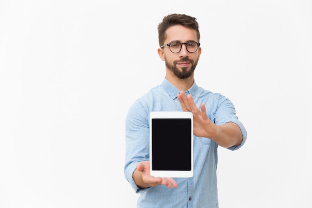 Positive satisfied tablet user showing blank screen