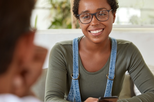 Free photo positive teenage girl has dark healthy skin