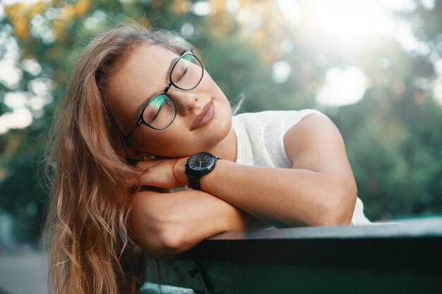 Positive woman having a break from city noise