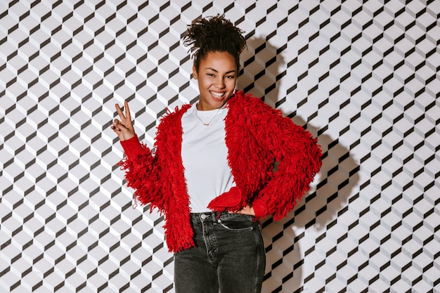 Positive woman showing peace sign