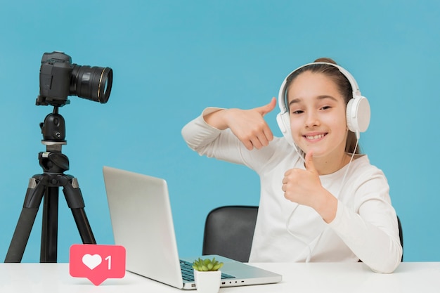Positive young girl happy to record for personal blog