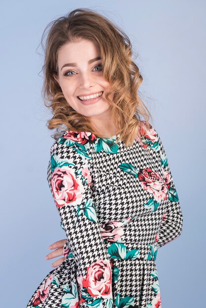 Positive young lady in elegant dress