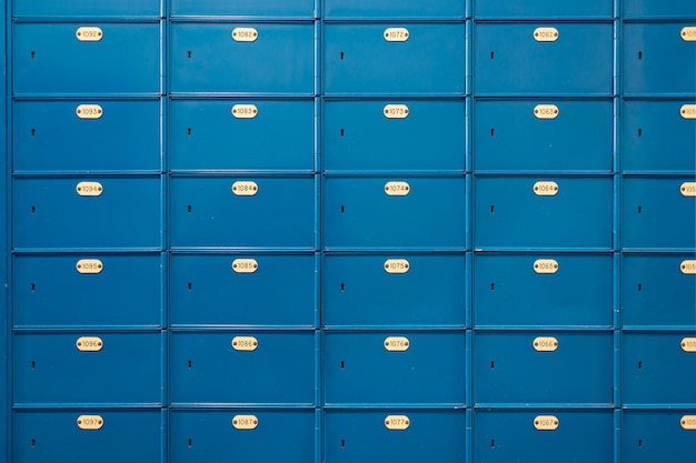 Postcode lockers in blue and plate with the identification number