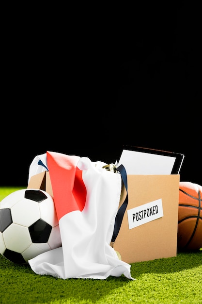 Free photo postponed sports event objects arrangement in box