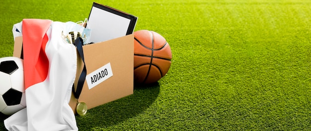 Postponed sports event objects in box with copy space