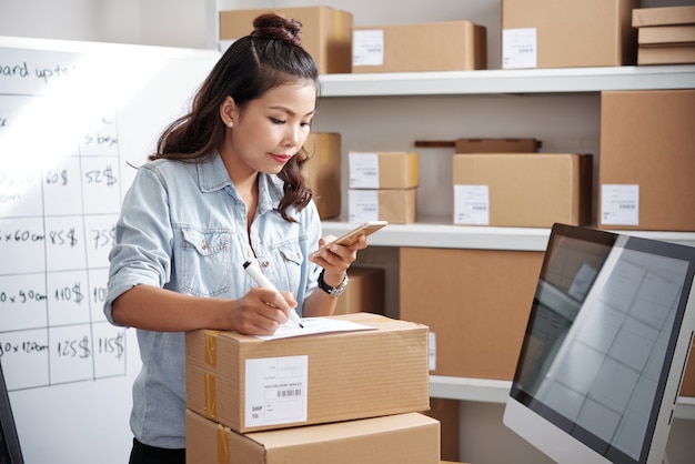 Postwoman working at office