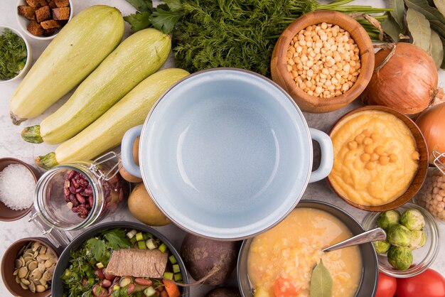 Pot surrounded by soup ingredients