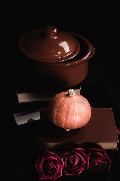Pot with pumpkin and roses