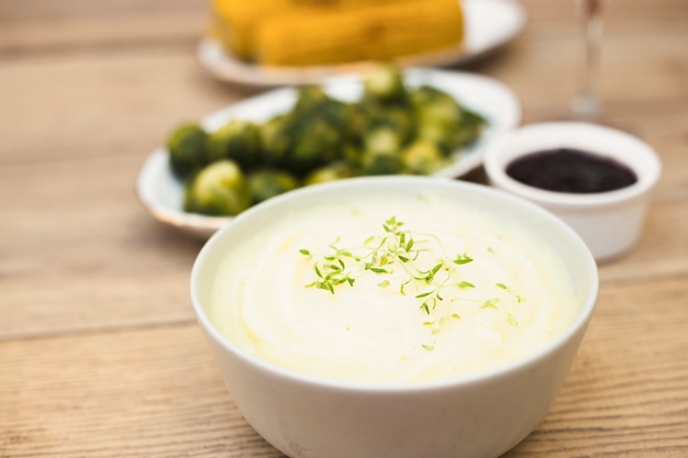 Potato puree in bowl on table 