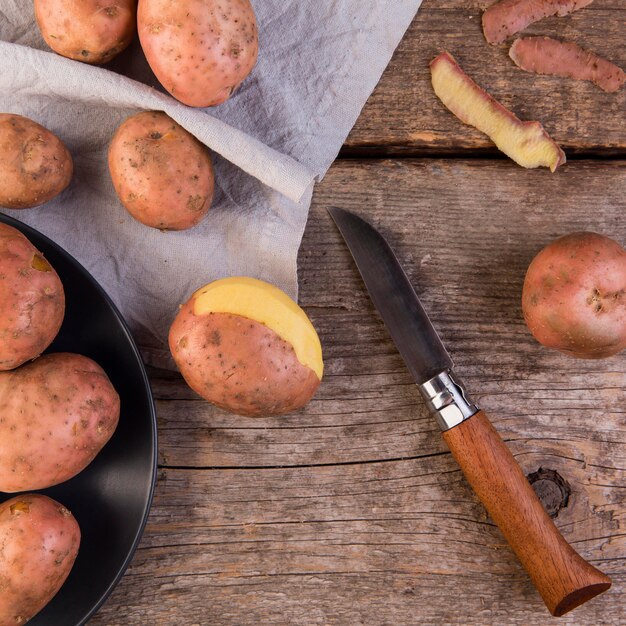 Potatoes arrangement on wooden background