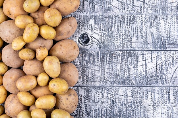 Potatoes on a gray wooden table