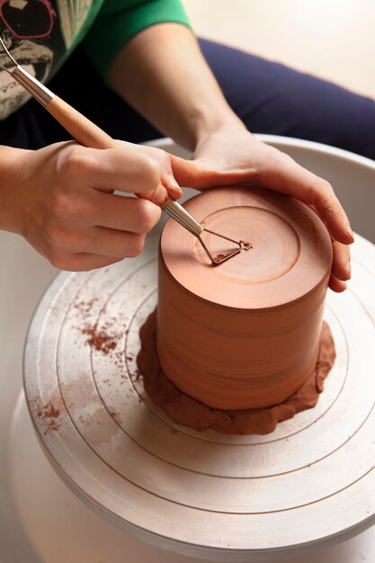 Pottery craftsperson in the studio creating ceramics