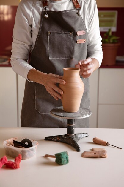 Pottery craftsperson in the studio creating ceramics