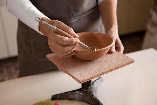 Pottery craftsperson in the studio creating ceramics