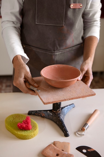 Pottery craftsperson in the studio creating ceramics