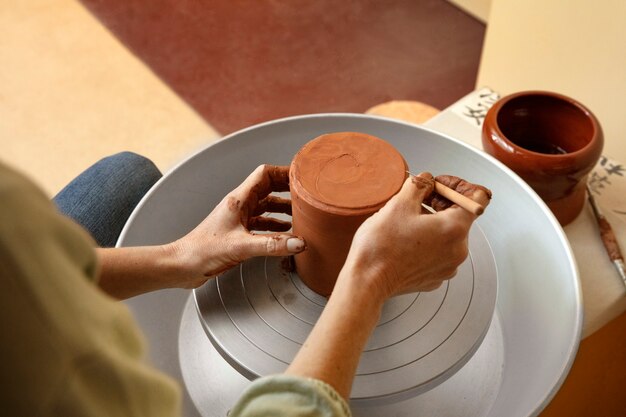 Pottery craftsperson in the studio creating ceramics