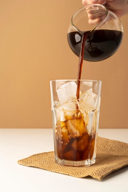 Pouring coffee in glass