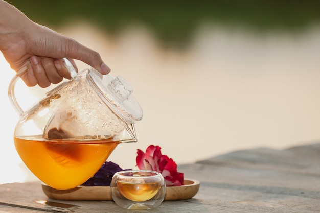 Pouring hot tea in the glass