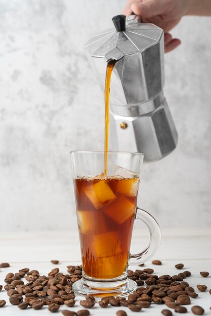 Pouring iced coffee in glass