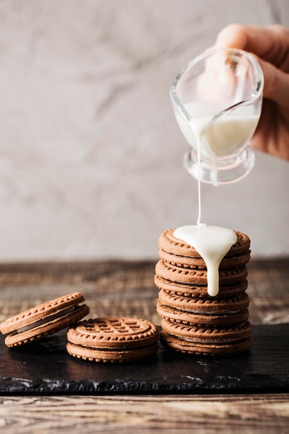 pouring milk on Delicious cookies