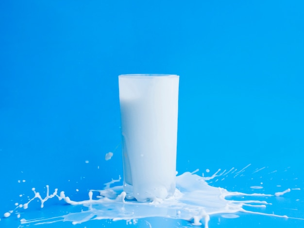 Pouring milk out of glass