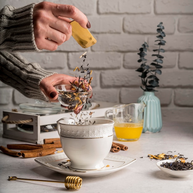 Pouring tea herbs