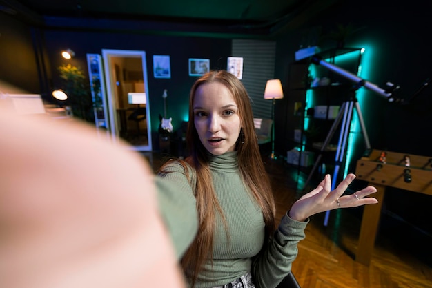 POV of girl in home studio connecting with loyal audience during livestream