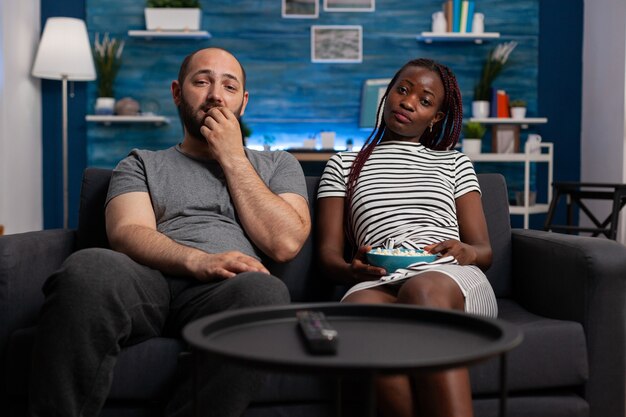 Pov of interracial couple watching television enjoying activity