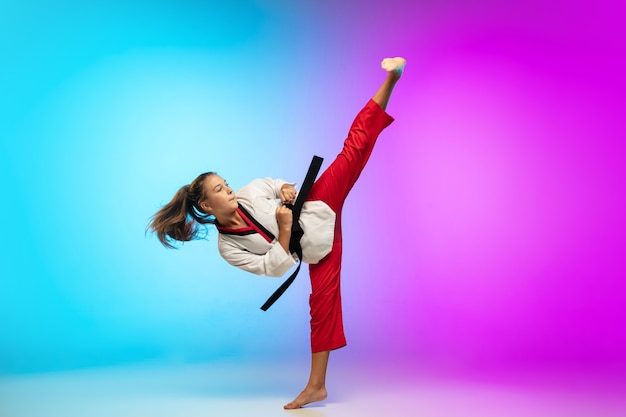Free photo practice. karate, taekwondo girl with black belt