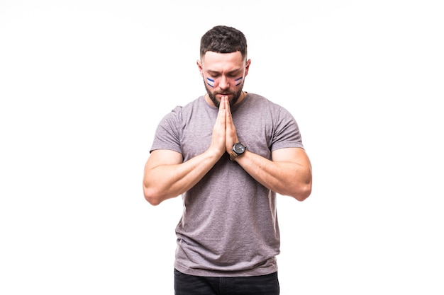 Free photo pray for portugal. argentina football fan pray for game of argentina national team on white background. football fans concept.