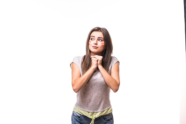 Pray for Spain. Spain woman football fan pray for game of Spain national team on white background. Football fans concept.