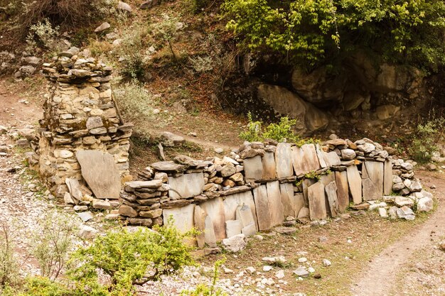 Prayer stone wall on the road in the himalayas