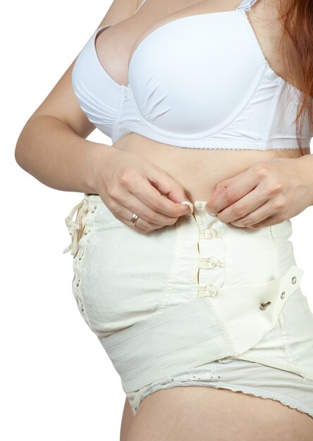 pregnant woman dressing maternity belt