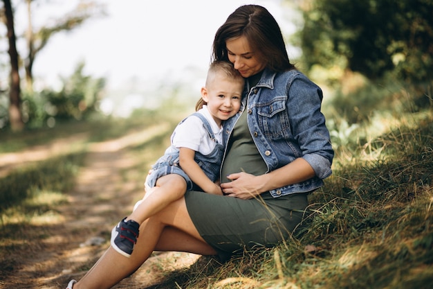 Pregnant woman and her little son